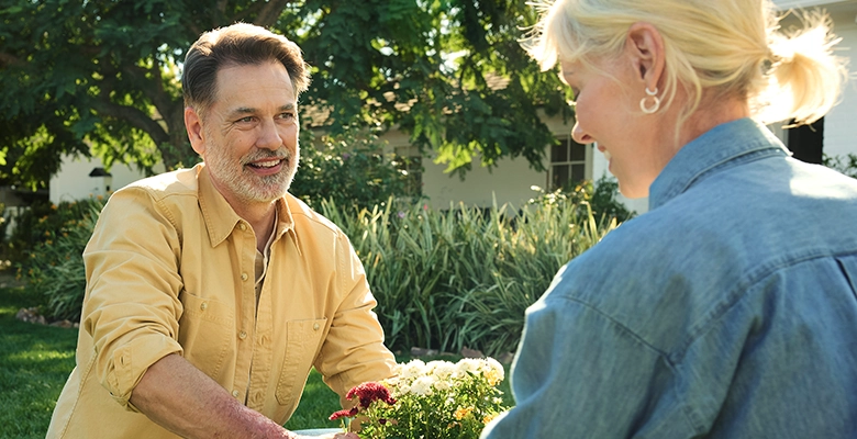 patient and his partner gardening